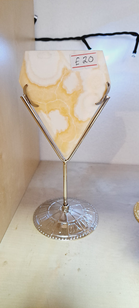 Yellow calcite diamond on stand