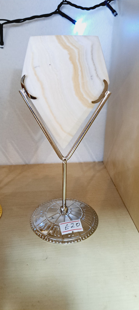 Yellow calcite diamond on stand