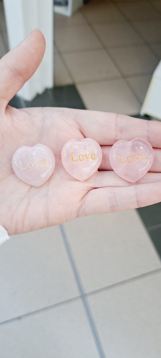 Rose quartz heart with love engraved