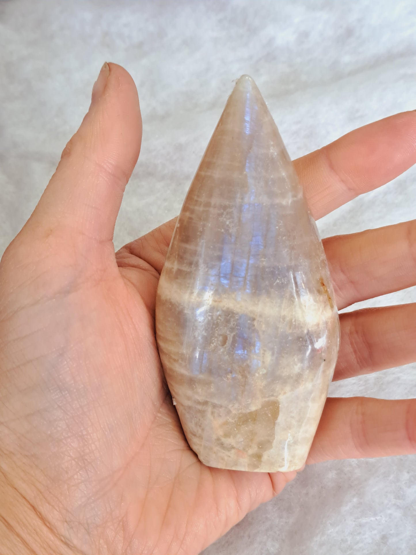 Polished white moonstone point