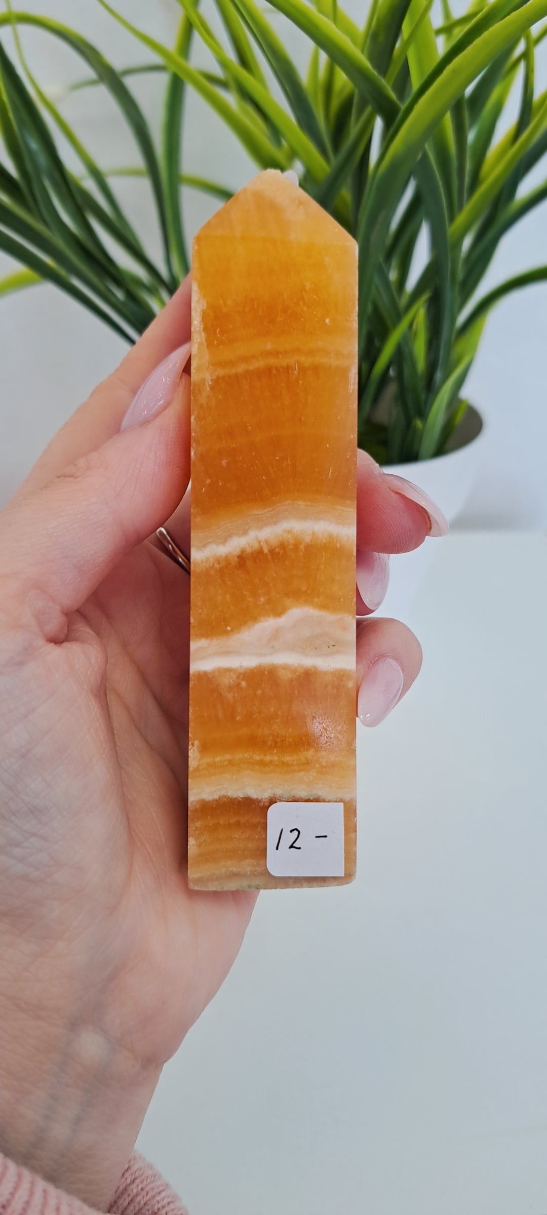 Banded orange calcite tower (damaged point)