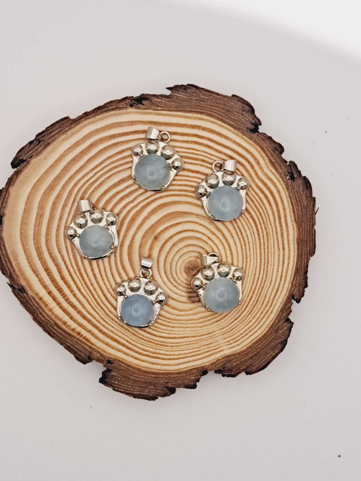 Aquamarine paw pendant