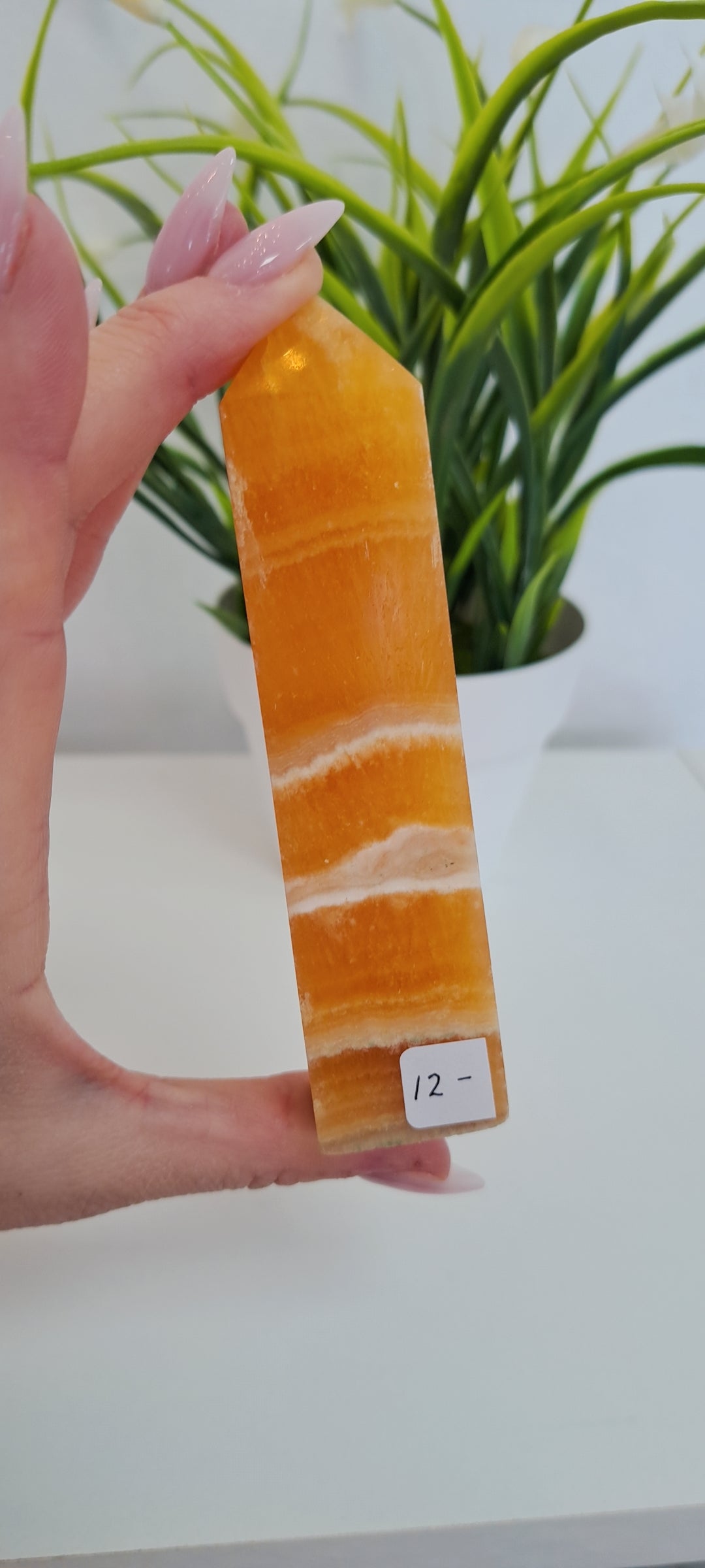 Banded orange calcite tower (damaged point)